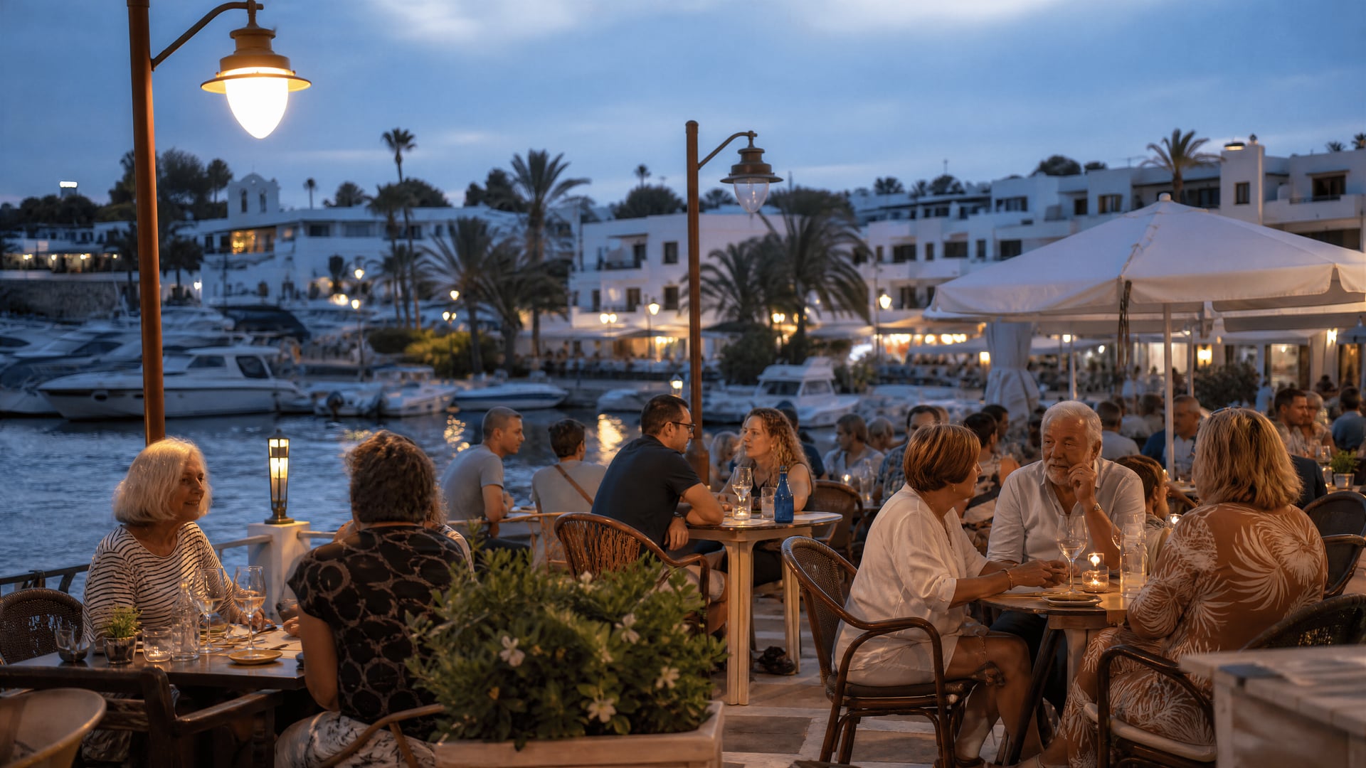 Harbour café terrace in Cala d'Or with evening diners and social club atmosphere