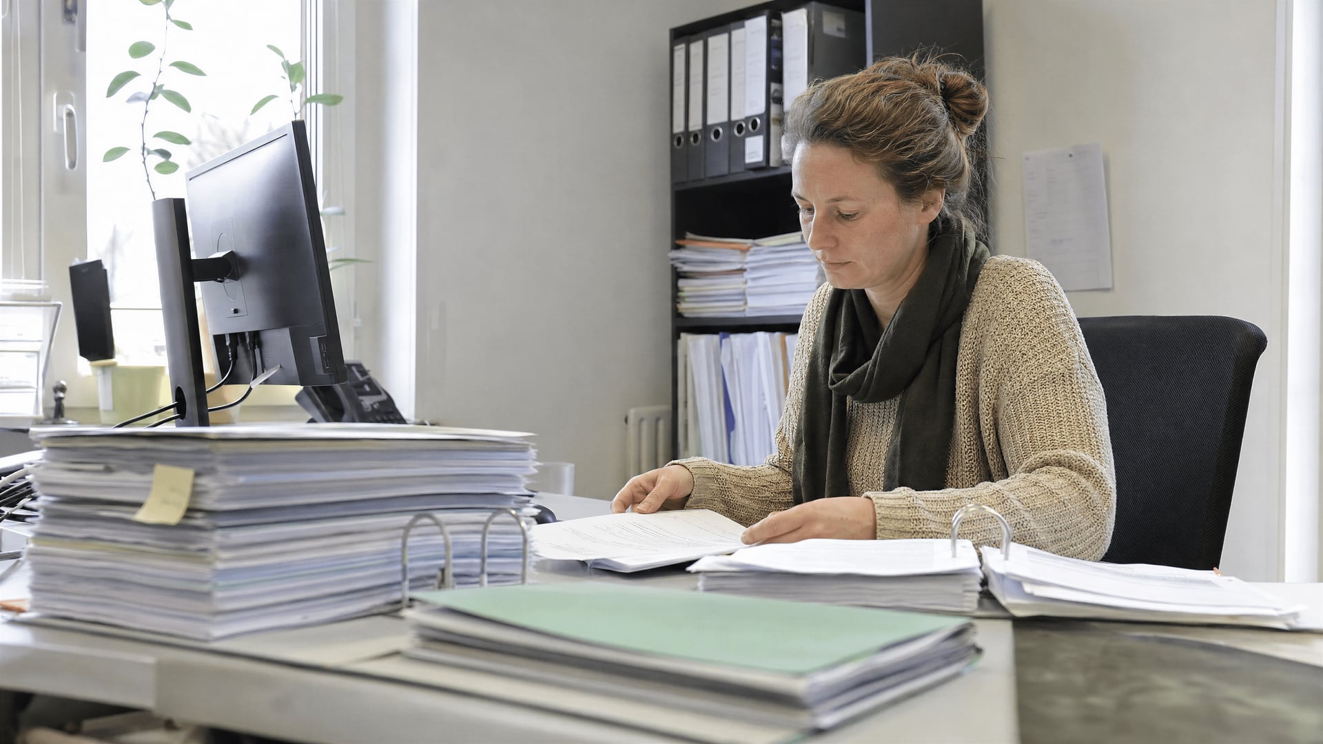 Bavarian planning office desk with permit papers tied to cannabis cultivation-association approval.