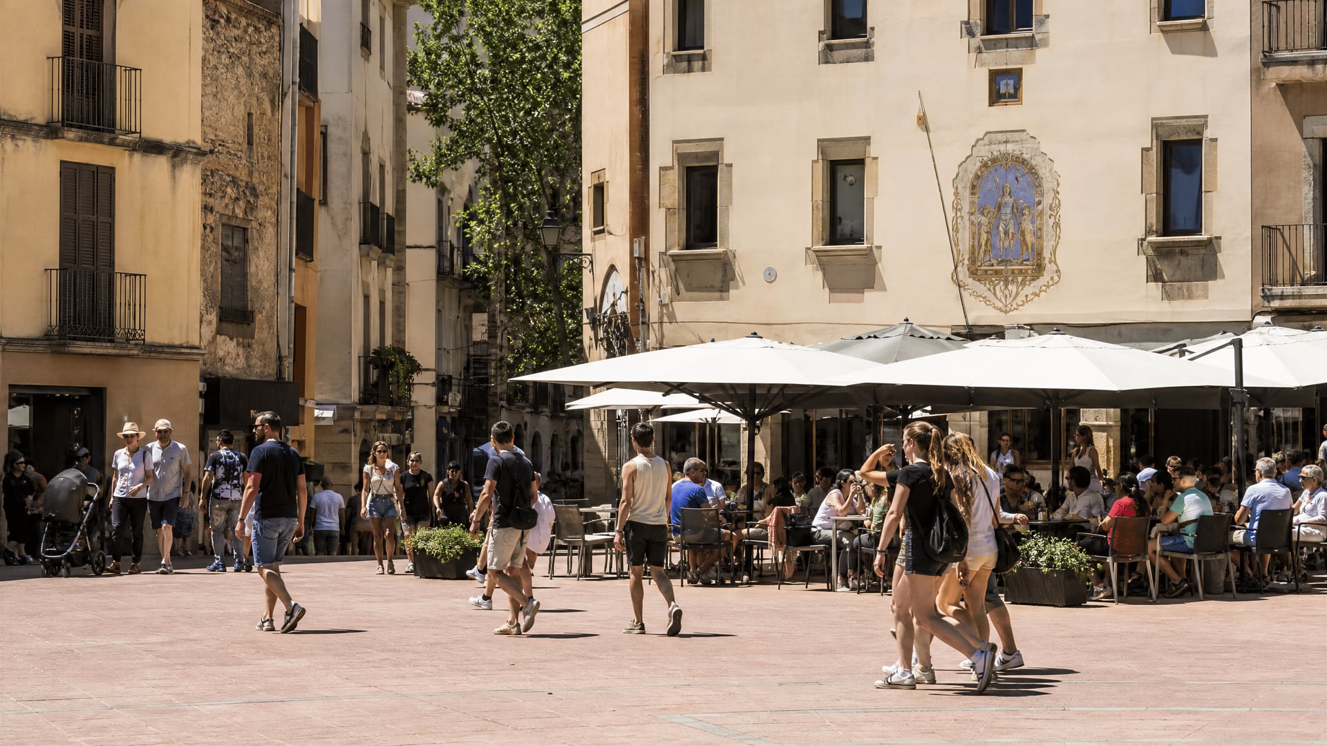 Lloret de Mar old town plaza with everyday life near club neighborhoods