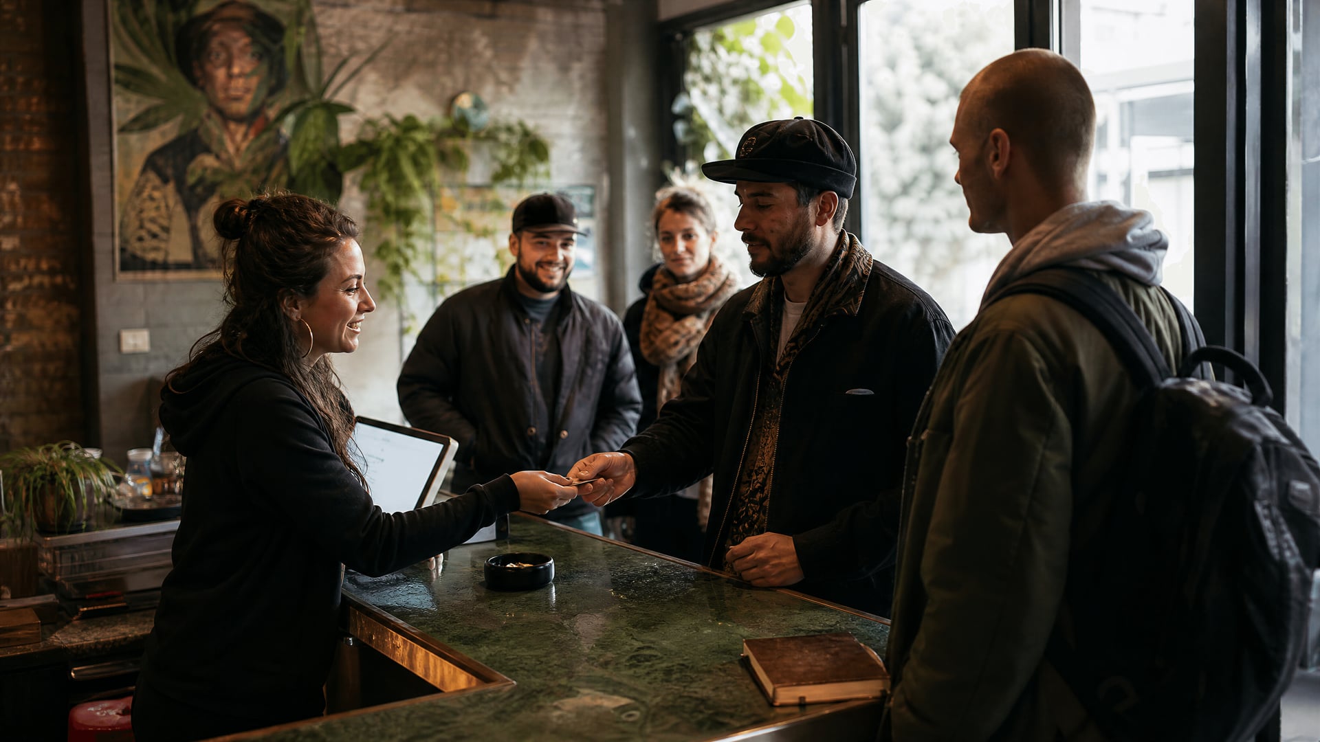Reception desk in Netherlands cannabis social club with members checking in