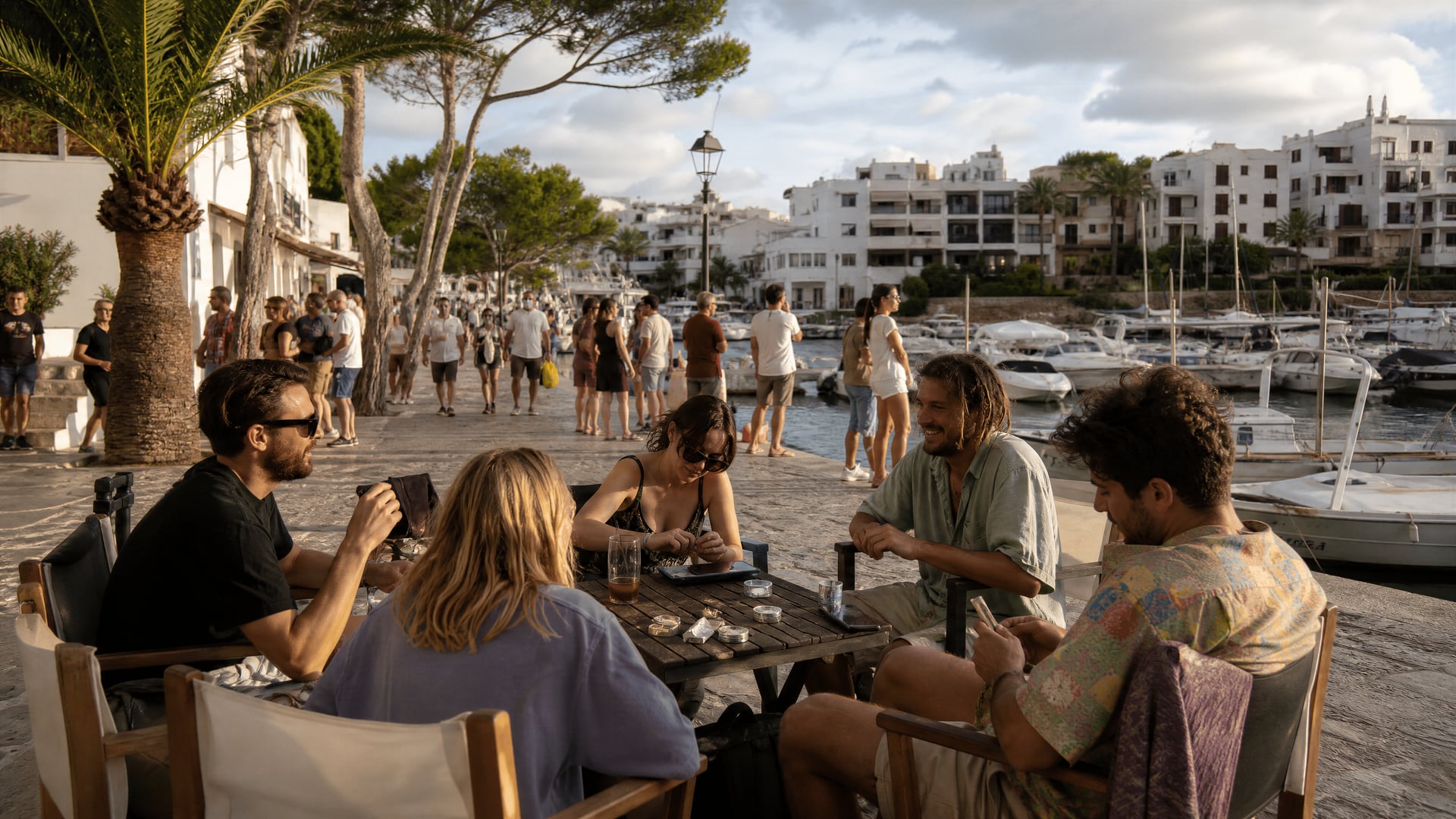 Cala d'Or waterfront promenade with marina life and cannabis social club context