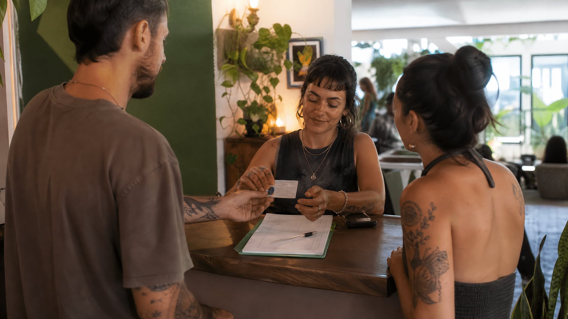 Palmanova reception desk with membership form, ID check, and cannabis club check-in