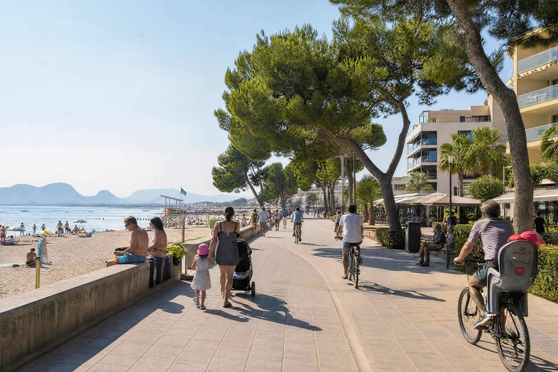 Playa de Muro seafront with everyday life near cannabis social club context