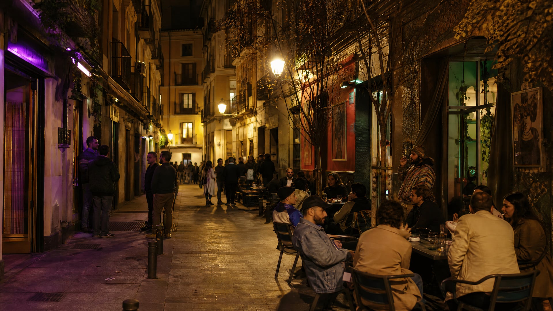 Madrid alley at night with local streetscape and cannabis social club atmosphere