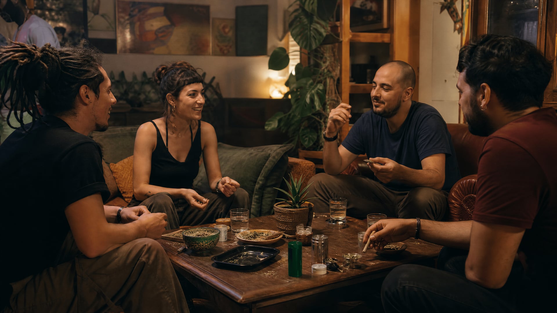 Members chatting in a Catalonia cannabis social club lounge after dinner