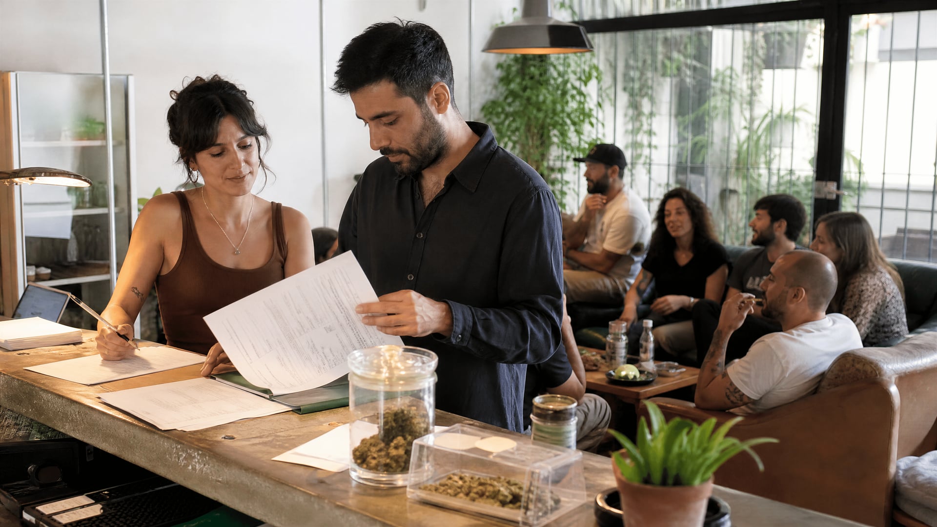 Alicante members-only reception with club paperwork and calm social club atmosphere