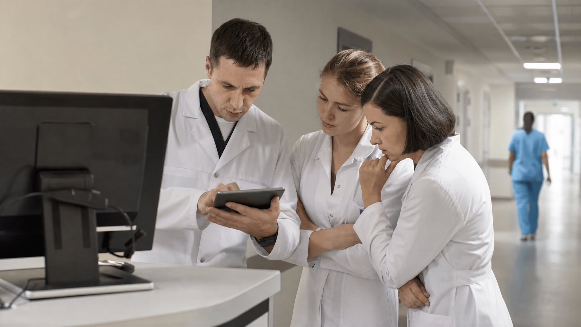 Neurology staff in a Vinnytsia hospital corridor reviewing electronic prescription records