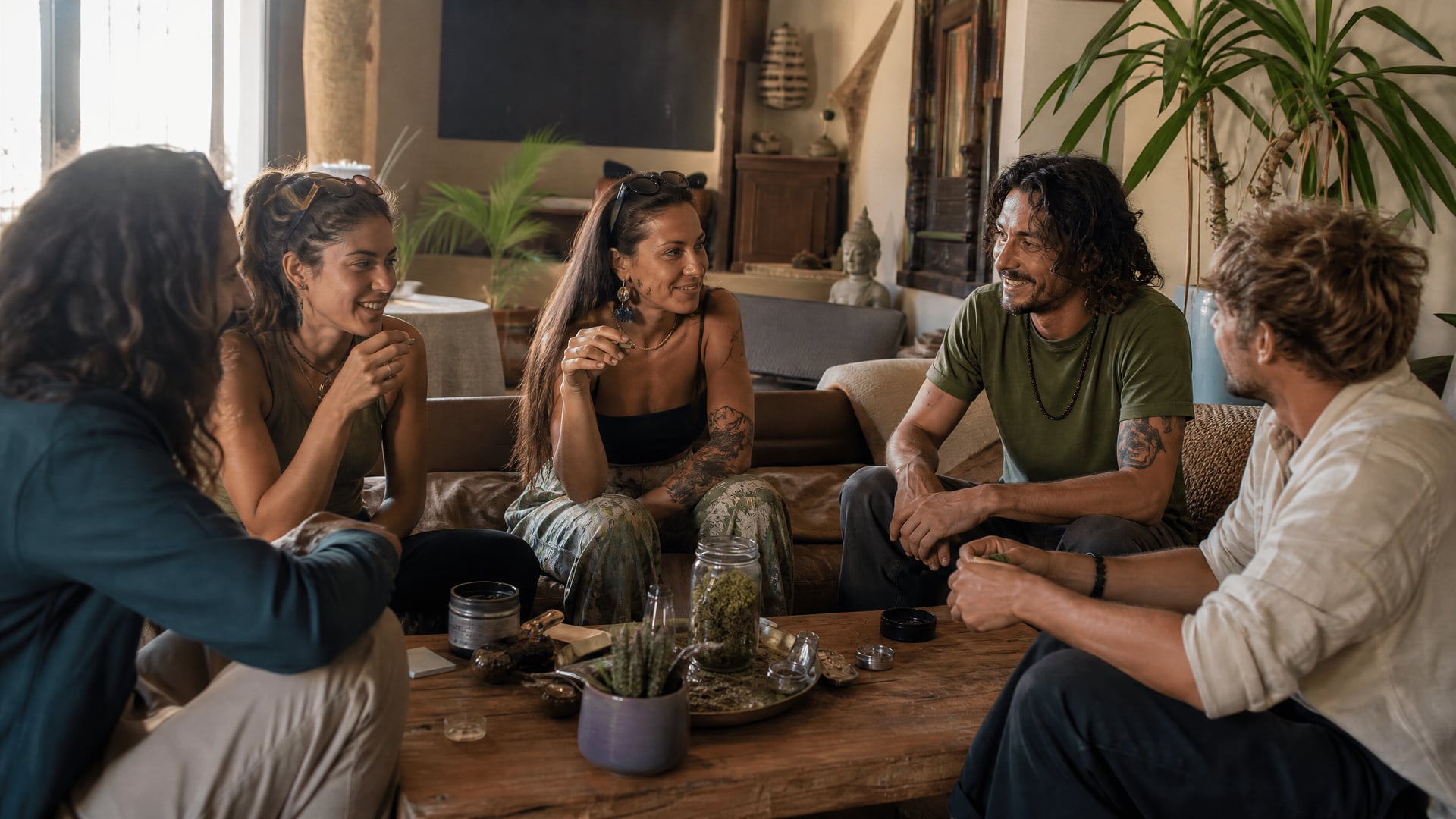 Small Ibiza cannabis social club table gathering with members talking quietly