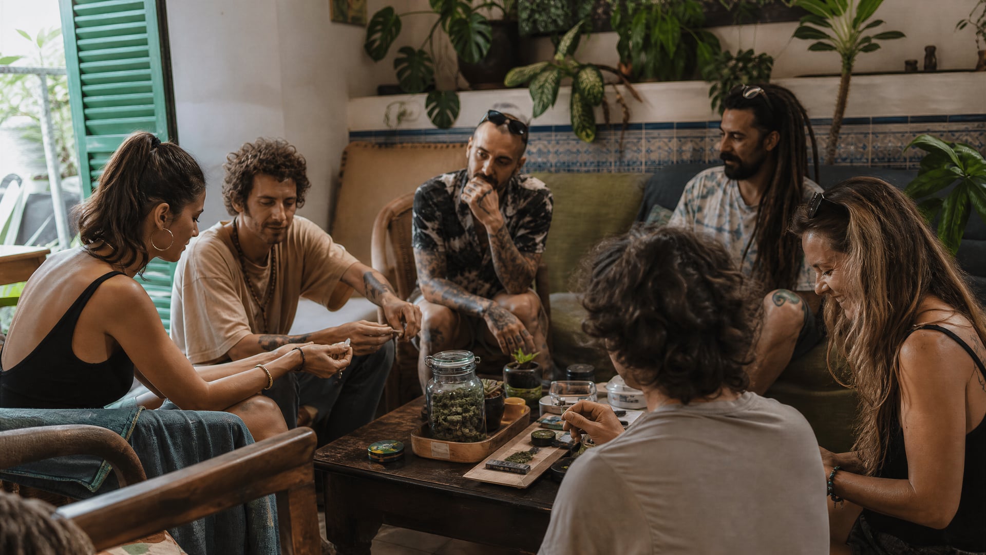 Palma members gathered around a low table in a Majorca cannabis social club