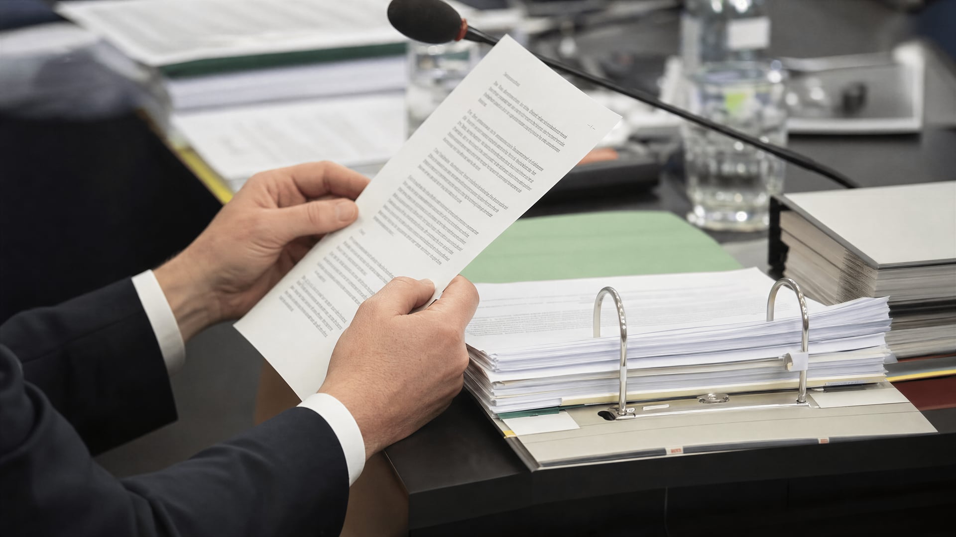 Bundestag committee materials and draft law pages laid out for a medical cannabis hearing.